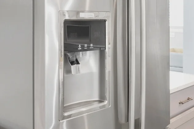 A stainless steel refrigerator with an in-door water and ice dispenser